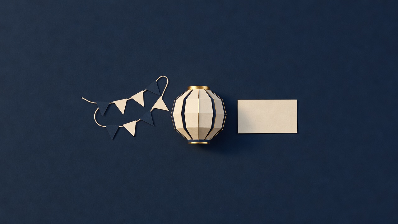 Paper-cut still life of a string of bunting, a paper lantern and a blank ticket
